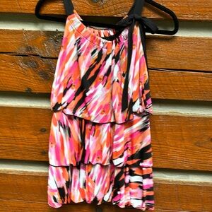 Women’s dressy tank top. Multi-colored with layered ruffle and bow tie details.